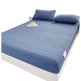 Huitich fitted sheets on a waterproof king size mattress topper with matching blue pillows